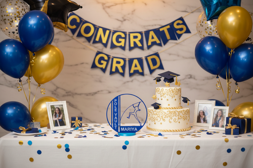 Graduation party cake table with pole vault award